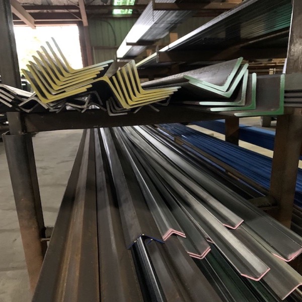 Angle and flat bar stacked on a rack in the warehouse